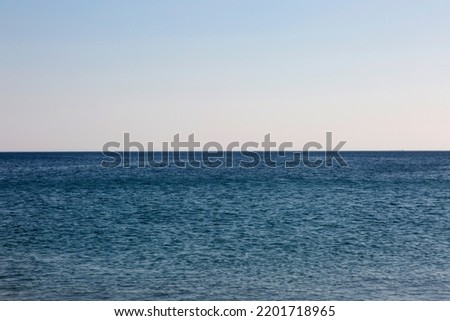 Seascape with horizon line. Clear sea and blue sky. Nature, sea, vacation, travel and backgrounds concept. Horizontal. Royalty-Free Stock Photo #2201718965