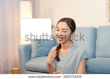 Asian woman talking at home at night with the speech bubble