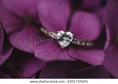 Silver Diamond Ring On A Purple Hydrangea Flower