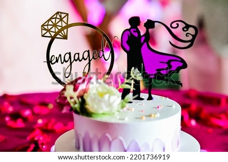 Wedding cake with flowers and Couple Silhouettes. Engagment Moment. Proposal Invitation. Symbols of Love and couple. Valentine Day.