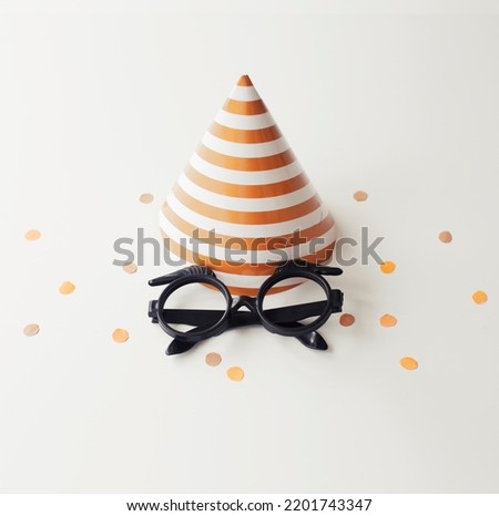 Birthday background with festive decorations,cones, glasses and present gift