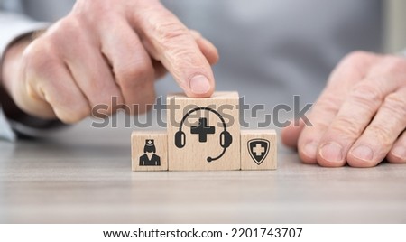 Wooden blocks with symbol of medical hotline concept