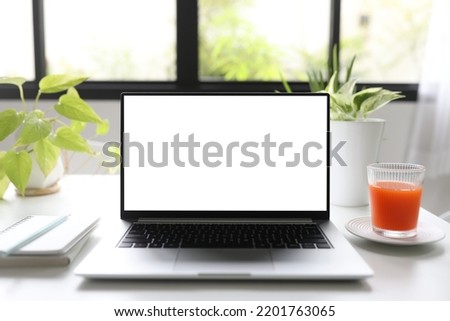  laptop and carrot juice work from home relaxation