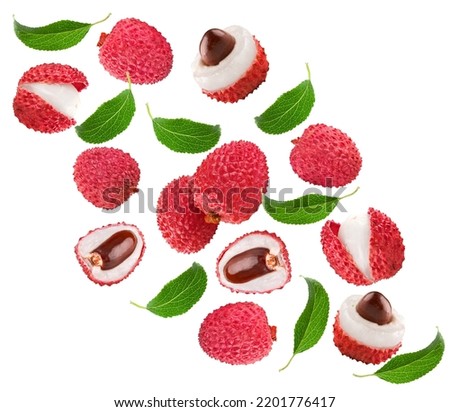 flying fresh lychee with slices and green leaves isolated on white background. clipping path Royalty-Free Stock Photo #2201776417