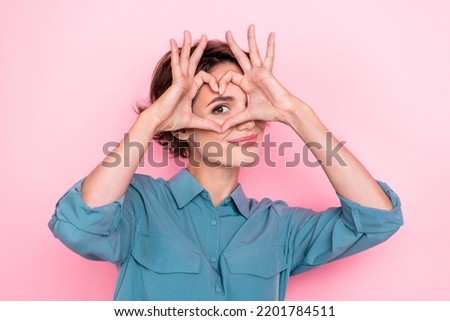 Portrait of adorable nice person arms fingers demonstrate heart symbol eye isolated on pink color background Royalty-Free Stock Photo #2201784511