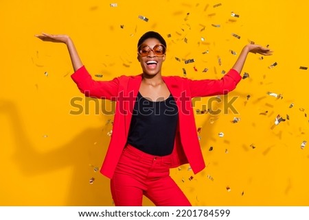 Photo of stylish short hair female guy enjoy disco event confetti wear red jacket blazer isolated vivid color background Royalty-Free Stock Photo #2201784599