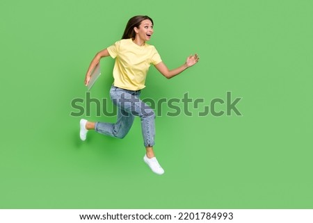 Full length photo of overjoyed lady office worker hold gadget go conference meeting run empty space isolated on green color background