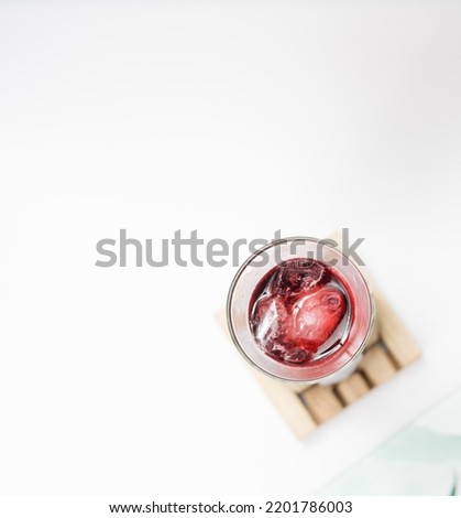 bowl of healthy food , vegetables , salad and red fruit drink , on a very clean white background
