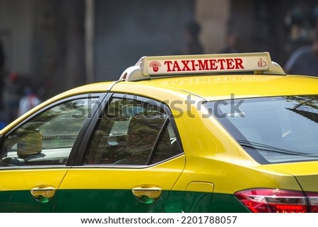 Taxi Meter sign on the roof of a taxi.