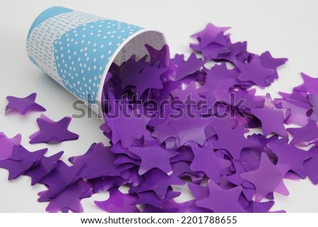 purple stars confetti isolated on white background
