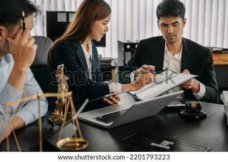 Asian Business and Male lawyer or judge consult having team meeting with client, Law and Legal services concept.Customer service good cooperation in modern office
