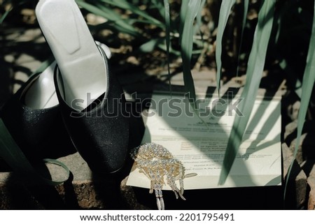 Shoe decorations and invitation cards at Indonesian weddings.