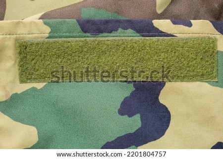 Velcro strip on army woodland camouflage