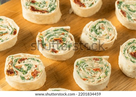Homemade Pinwheel Tortilla Appetizers with Cream Cheese and Spinach Royalty-Free Stock Photo #2201834459