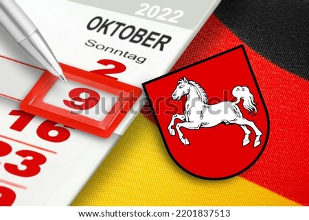 German calendar 2022  October 9   Sunday and emblem of Lower Saxony Royalty-Free Stock Photo #2201837513