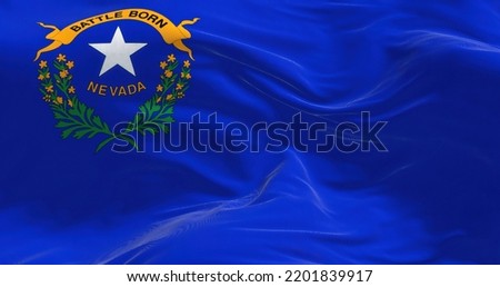 Close-up view of the Nevada state flag waving. Nevada is a state in the Western region of the United States. Fabric textured background