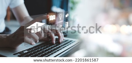 Concept of Online education. man use Online education training and e-learning webinar on internet for personal development and professional qualifications. Digital courses to develop new skills. Royalty-Free Stock Photo #2201861587