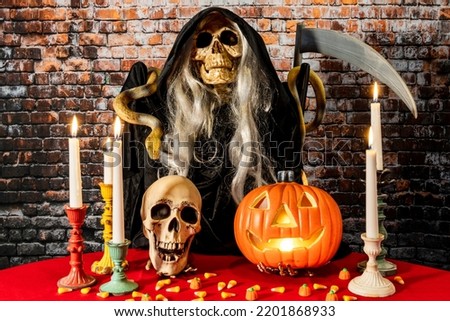 horizontal Halloween scene with grim reaper and jack o lantern
