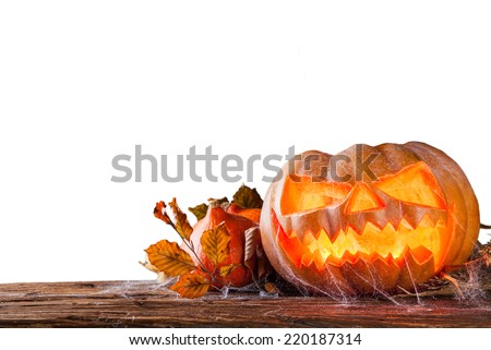 Spooky halloween pumpkin on wooden planks, isolated on white background