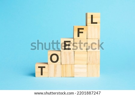 the word toefl is written on a wooden cubes, concept