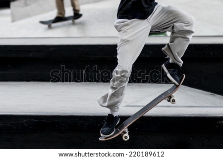 Close up of a skateboarders feet while skating
