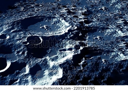The surface of the moon, with craters. Elements of this image furnished by NASA. High quality photo