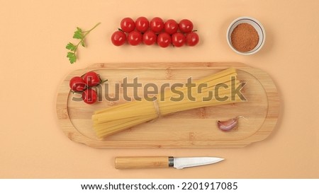 Kitchen background with ingredients for spaghetti cooking recipe, minimal cooking concept, traditional italian cuisine, business card for restaurant, cafe, shop, menu, selective focus, top view,