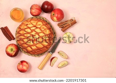 Apple pie with honey,apples, spices, modern bakery concept, place for menu and recipe, selective focus, top view