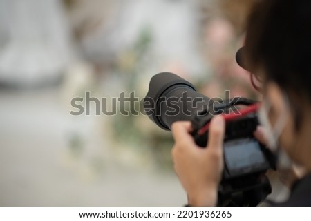 videographer close up, cameraman, man with camera, movie,
