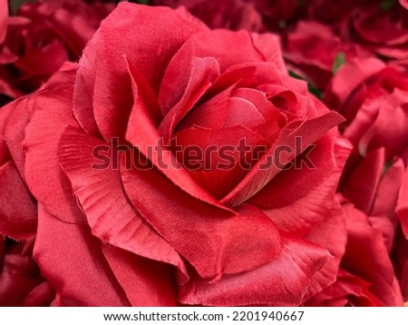 Artificial floral abstract background bright pink rose close up