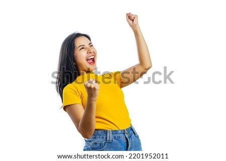 Pretty asian women soccer fans celebrating over white background isolated. Royalty-Free Stock Photo #2201952011