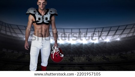 Composition of male american football player holding helmet over sports stadium. sport and competition concept digitally generated image.