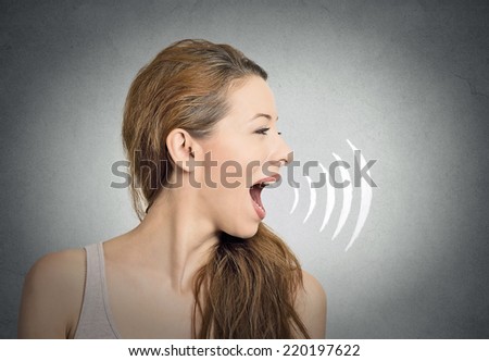 portrait young woman talking with sound waves coming out of her mouth isolated grey wall background. Human face expressions
