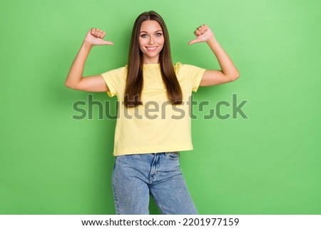 Portrait of gorgeous cute adorable girl with long hairstyle dressed yellow t-shirt directing herself isolated on green color background