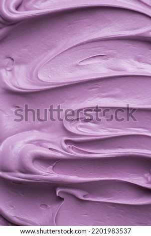 Violet purple icing frosting close up texture
