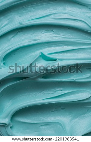 Aqua blue icing frosting close up texture