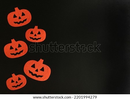  Beautiful pumpkin on a black background. Creative halloween concept backdrop. halloween pumpkin craft