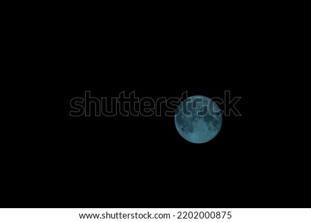 Full moon with black dark sky in summer hot fresh night