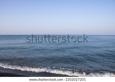 Sunny morning on the Black Sea Sochi. Journey to the paradise sea beach. Sochi landscapes. Journey to the Caucasus. Beautiful summer background.