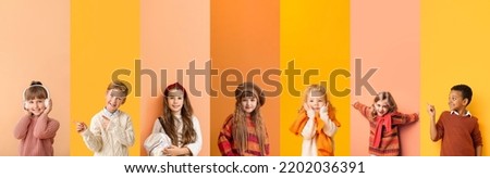 Set of children in warm sweaters on colorful background Royalty-Free Stock Photo #2202036391