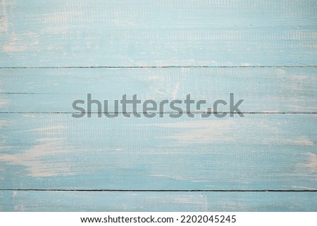 Painted wooden strips background for studio photography. Grunge light blue color wooden planks backdrop for still life or product photography.
