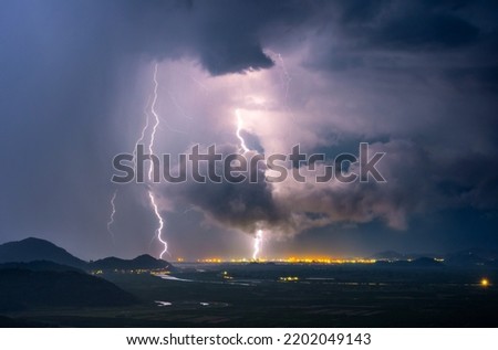 A major thunderstorm in Croatia. Pictured show the Neretva River Valley being swallowed by storm