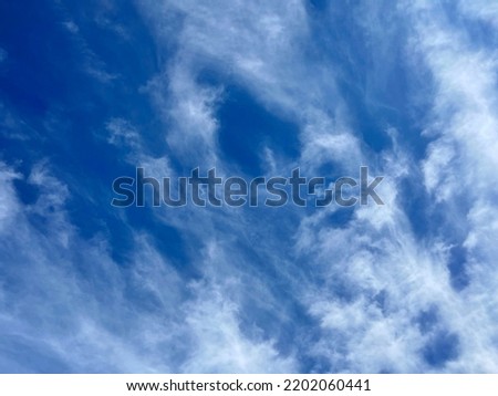 blue sky with beautiful natural white clouds. Celestial clouds background. Blue summer.