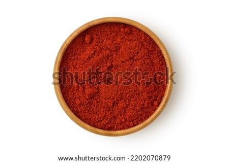 Paprika powder in wooden bowl on white background Royalty-Free Stock Photo #2202070879