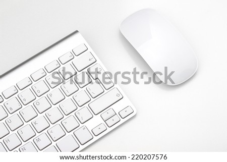 Keyboard and mouse on a white background, close-up