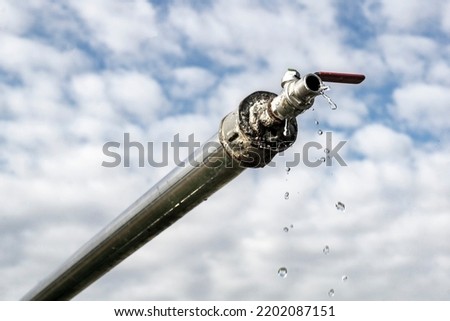 Clear Water Artesian Well, african hold-ups with water water from the spring Royalty-Free Stock Photo #2202087151