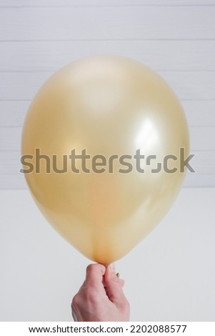 golden latex balloon isolated on white background