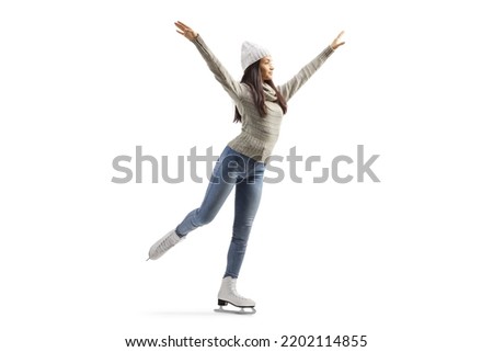 Full length shot of a young casual female ice skating isolated on white background