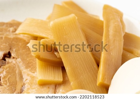 Bamboo shoots boiled, sliced, fermented, dried or preserved in salt, then soaked in hot water and sea salt.