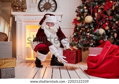 Santa Claus with a big red bag of gifts rush to bring present to children. New year and Merry Christmas , happy holidays concept
